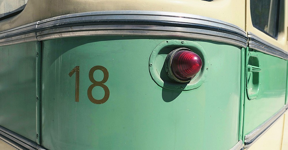 A vintage camper van, showing the number 18